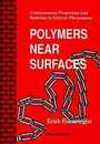 Polymers Near Surfaces: Conformation Properties and Relation to Critical Phenomena