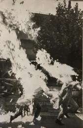The clothing of two Japanese leftist students caught fire yesterday when they tried to hurl molotov cocktails during a cla