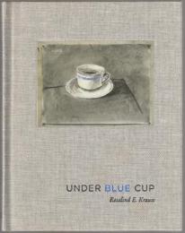 Under blue cup.