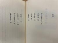 崩れる雲の下で