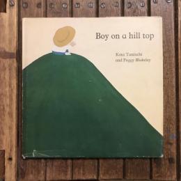 Boy on a hill top